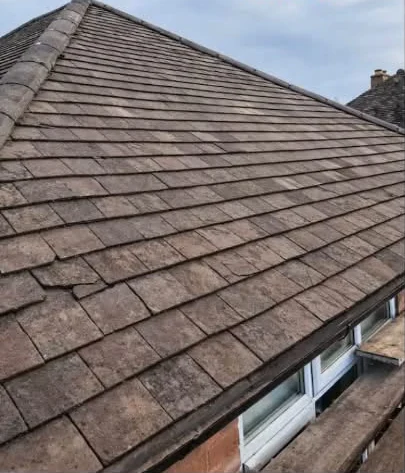 Weathered pitched roof before replacement